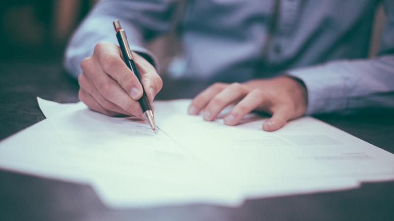 Man signing documents